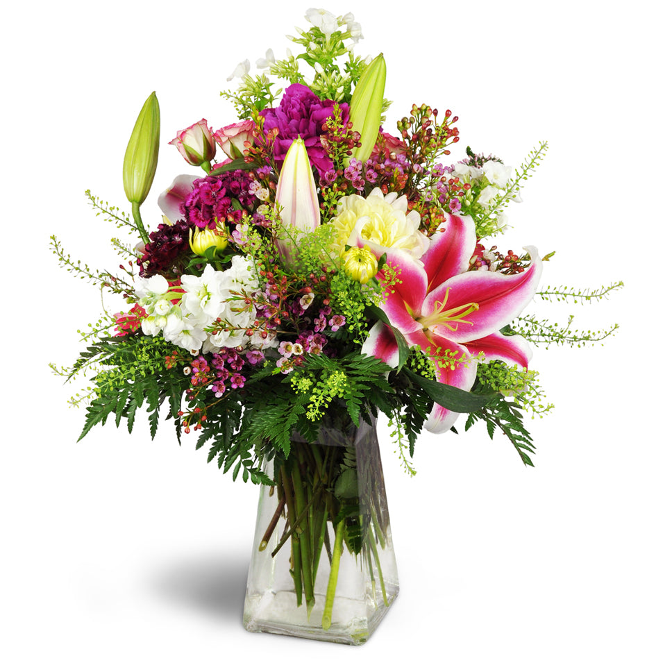 Spring’s Bounty Bouquet™ - Standard. Gift them a lovely bouquet filled with Stargazer lilies, dahlias, and seasonal blooms arranged in a pretty glass vase.