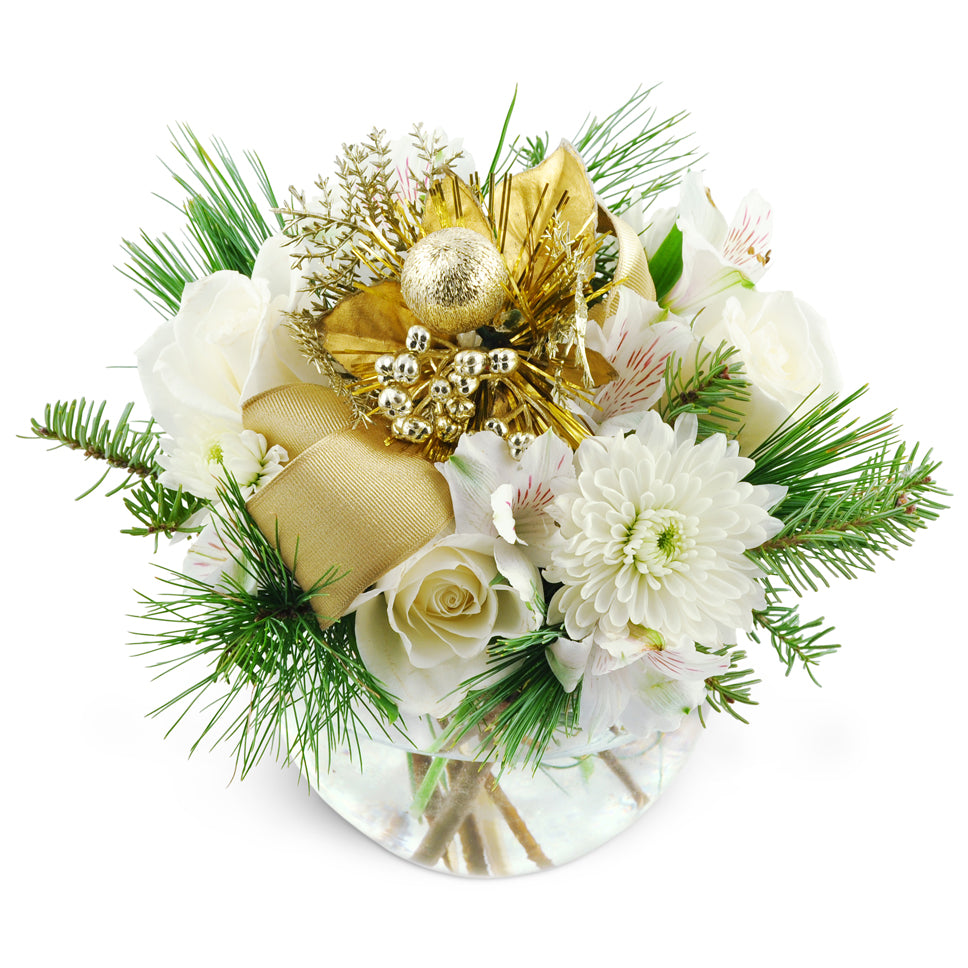 Your Holiday Star. Surprise them with white roses, mums, and more accented with holiday baubles and pine.