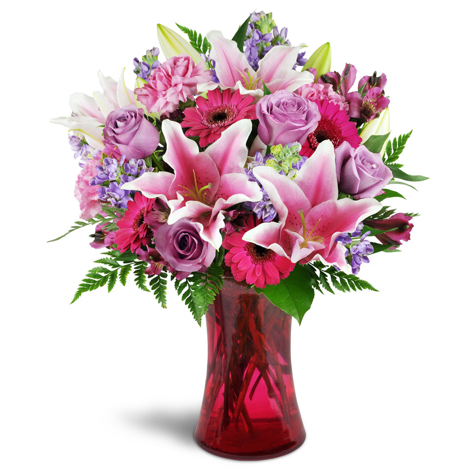 Bright Medley - premium flower arrangement. This arrangement includes a lively combination of Stargazer lilies, bright fuchsia mini Gerbera daisies, lavender roses, and more.