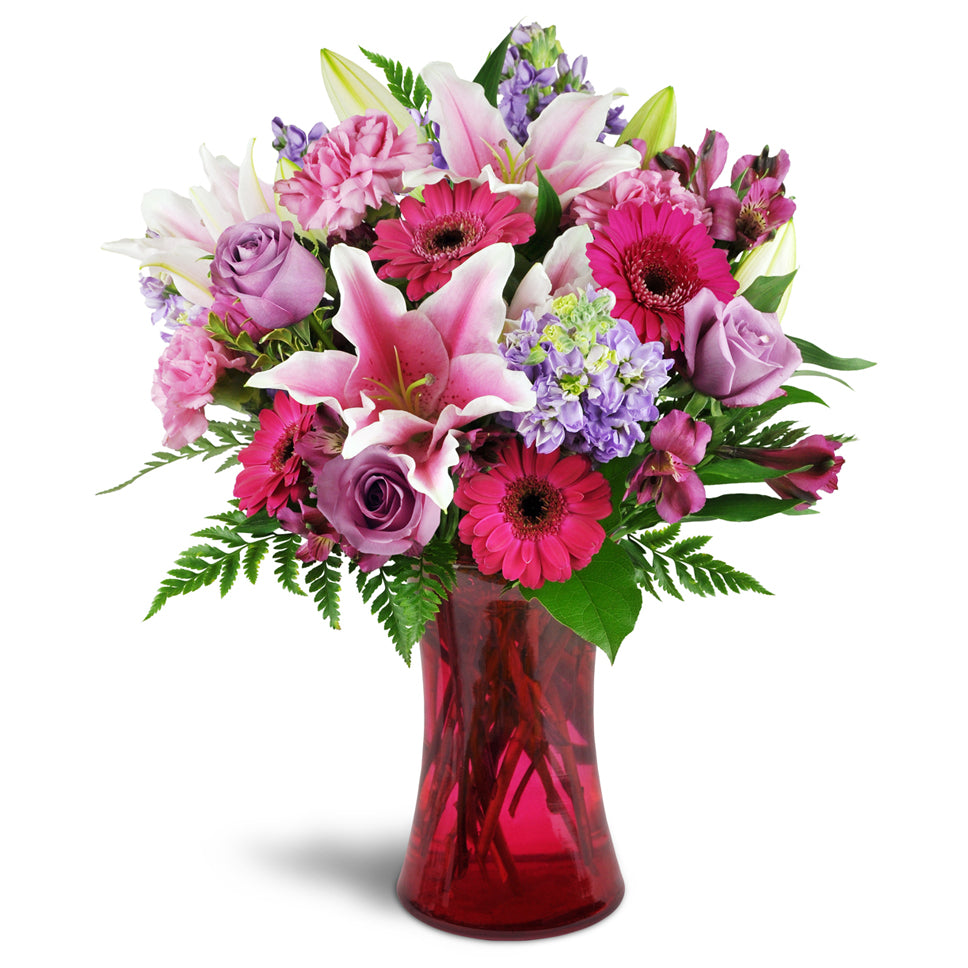 Bright Medley - deluxe flower arrangement. This arrangement includes a lively combination of Stargazer lilies, bright fuchsia mini Gerbera daisies, lavender roses, and more.