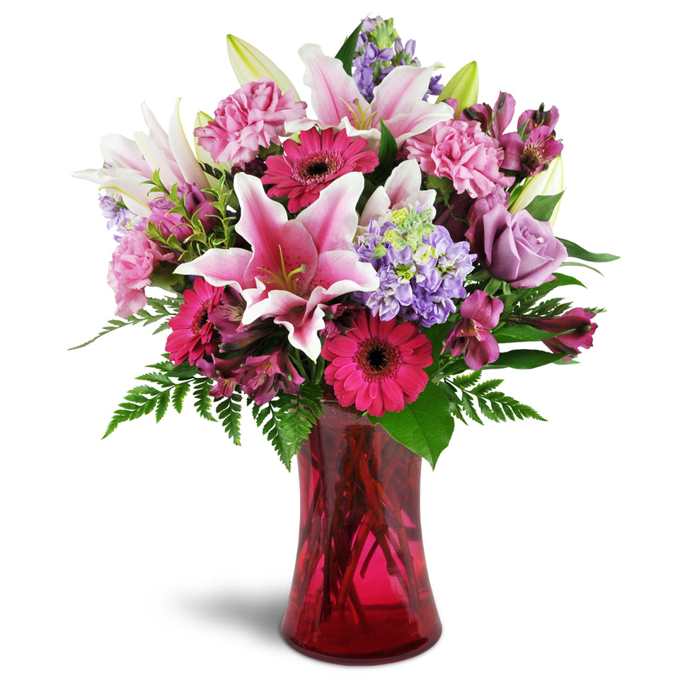 Bright Medley - standard flower arrangement. This arrangement includes a lively combination of Stargazer lilies, bright fuchsia mini Gerbera daisies, lavender roses, and more.