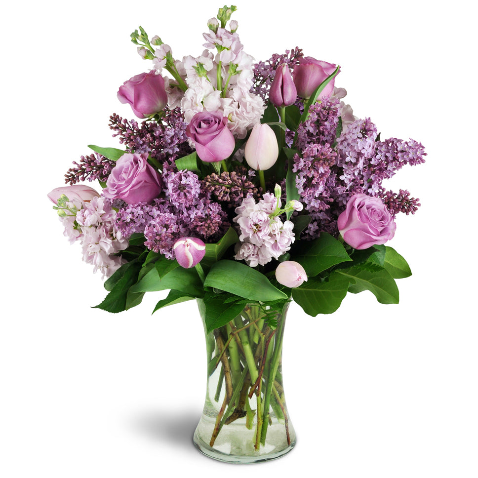 Fragrance Bouquet for Spring™ - Standard. Send them lovely lilacs, stock, tulips, and roses elegantly arranged in a glass vase.
