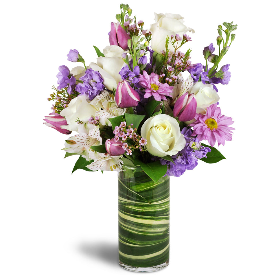 Smiling Grace™. Treat them to a graceful bouquet of roses, alstroemeria, tulips, stock, and daisies.