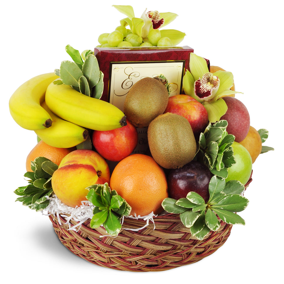 Fruit and Treats. Eighteen pieces of assorted fruit are arranged with three packages of chocolates and two cymbidium orchids.