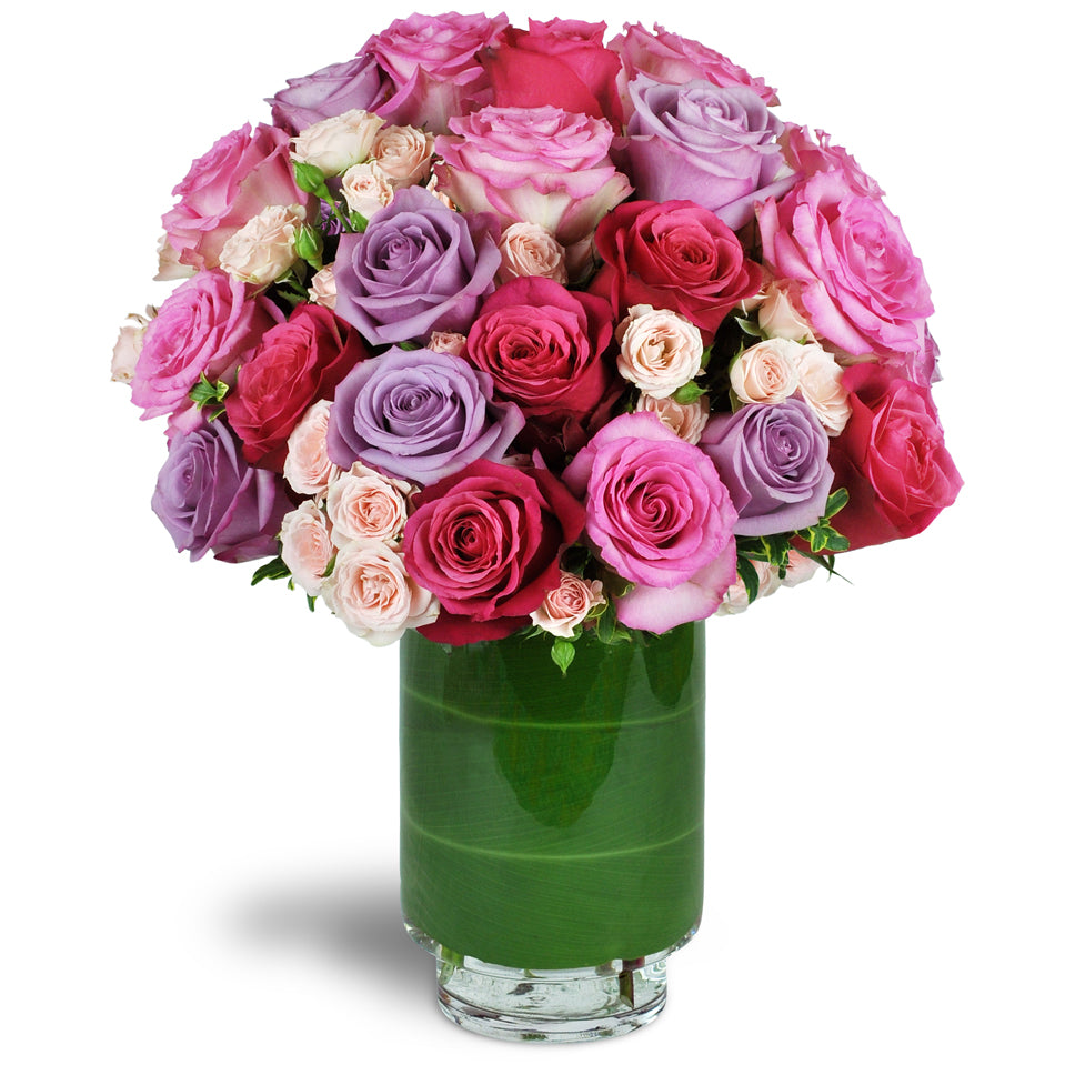 Sweetest Roses™. Two dozen premium roses are gorgeously arranged with delicate pink spray roses.