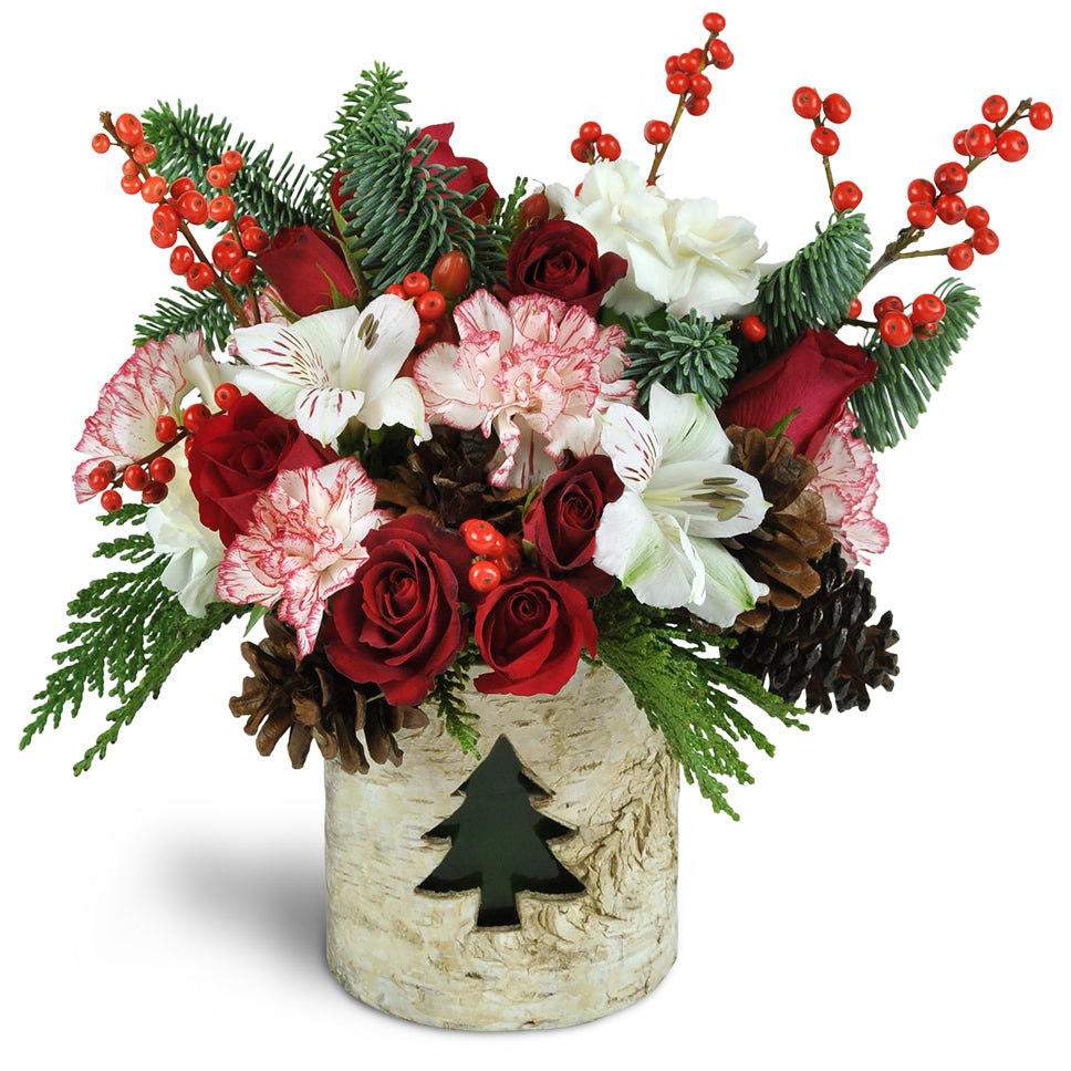 Yuletide Glow™. Treat them to spray roses, carnations, mini carnations, and more arranged in a reusable votive candle holder.