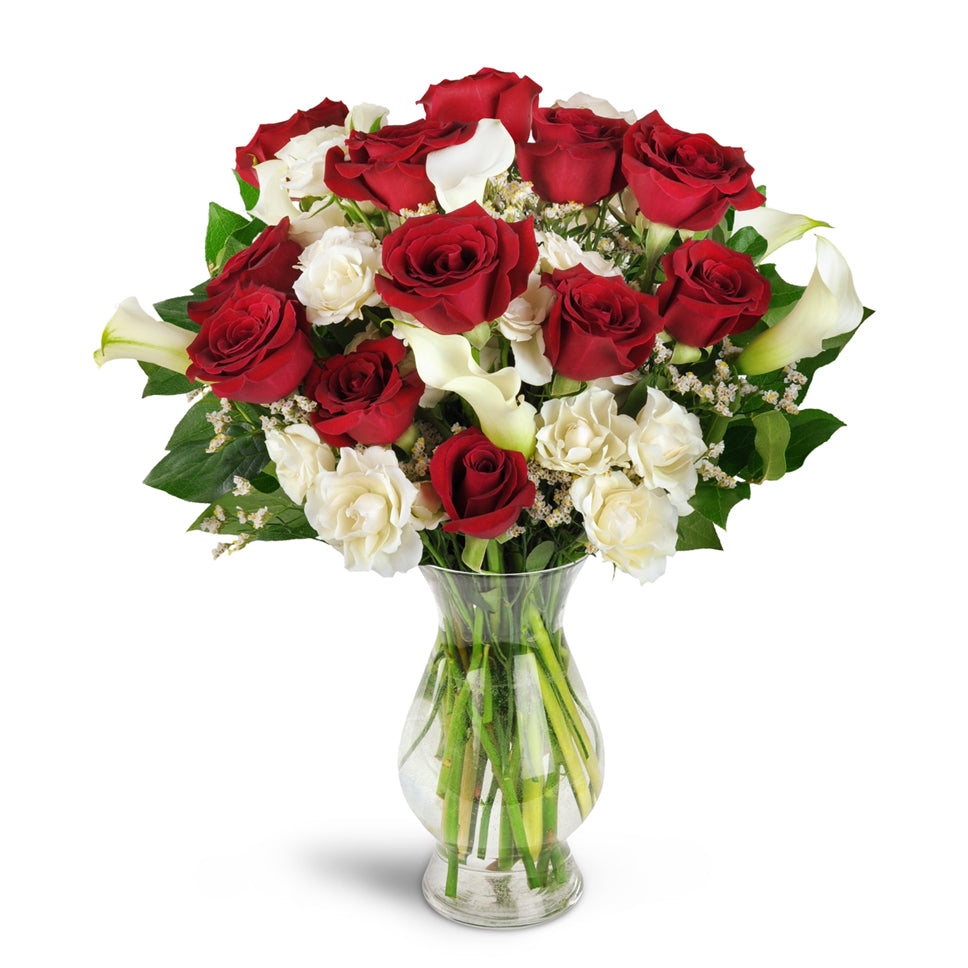 Love You Forever™ Bouquet - Deluxe. A dozen red roses are arranged with white spray roses, lush mini calla lilies, and more.