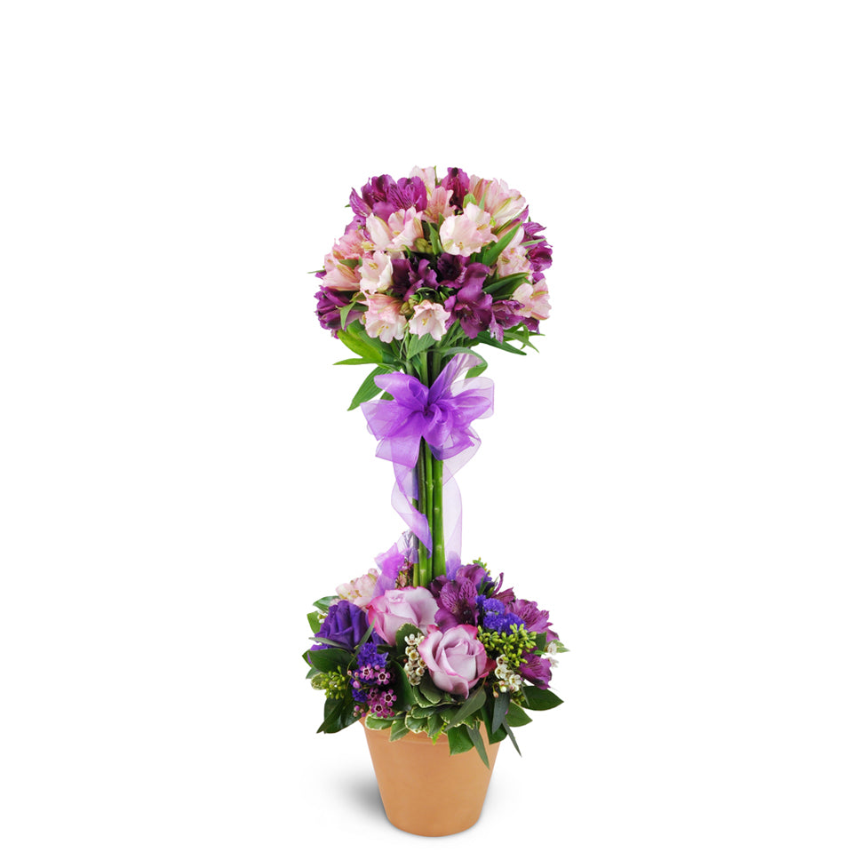 Elegant Embrace™ Topiary - Standard. Roses, lisianthus, and more are artfully arranged in a stunning design, encircling a topiary-style tower of alstroemeria blooms.