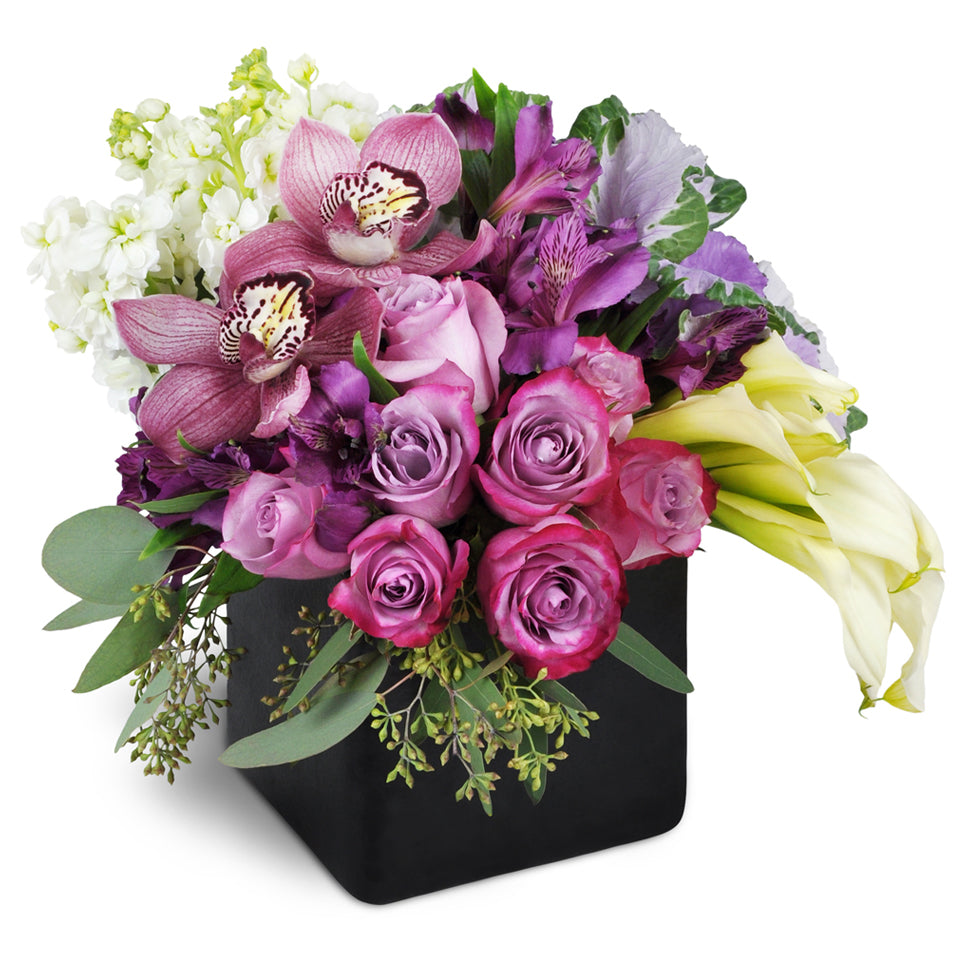 Breathtaking Beauty - premium flower arrangement. This stunning bouquet includes lavender roses, purple Peruvian lilies, white stock, and more.