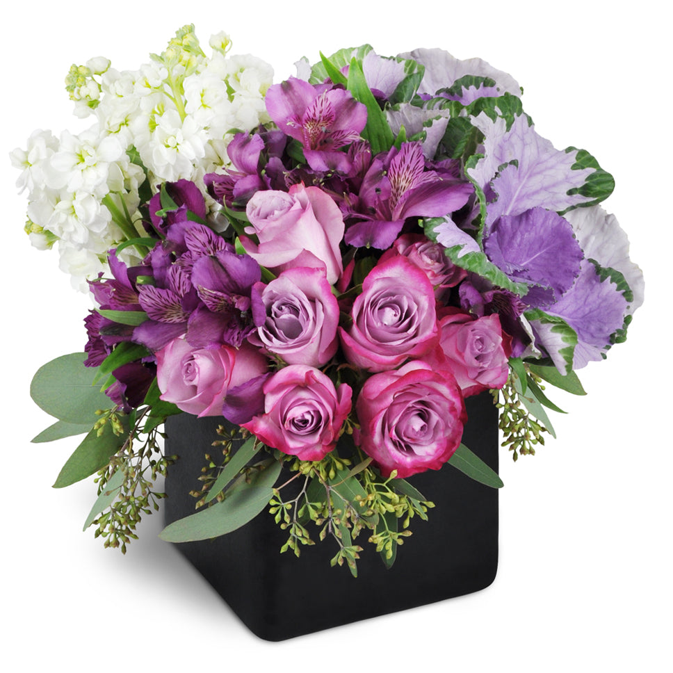 Breathtaking Beauty - standard flower arrangement. This stunning bouquet includes lavender roses, purple Peruvian lilies, white stock, and more.