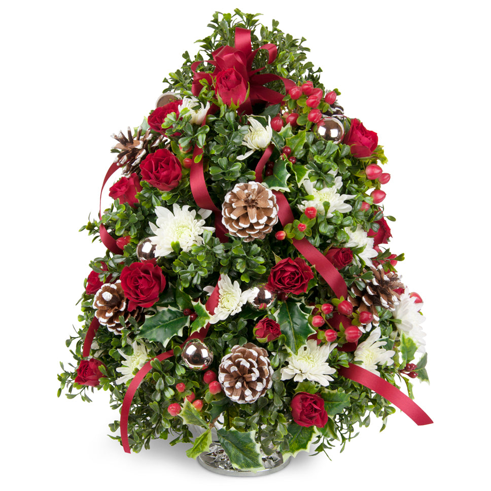 Celebration Flower Tree™ - Deluxe. Boxwood, holly, and more are accented with fresh blooms and cheerful ribbon.