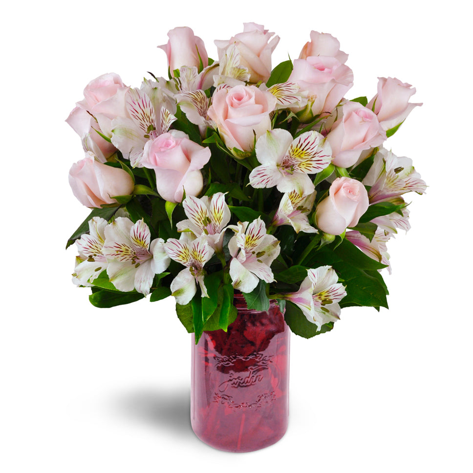 Blushing Love Bouquet - deluxe flower arrangement. Gorgeous pink roses and Peruvian lilies are delicately arranged into a stunning array of blooms.