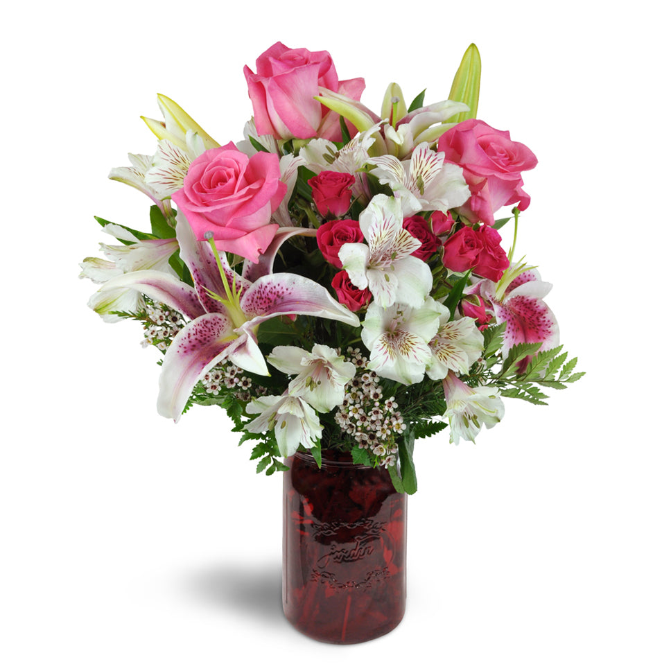 Classic Love Bouquet™ - Standard. Overflowing with pink roses, Stargazer lilies, Peruvian lilies, spray roses, and more, it's a perfect way to say I love you.