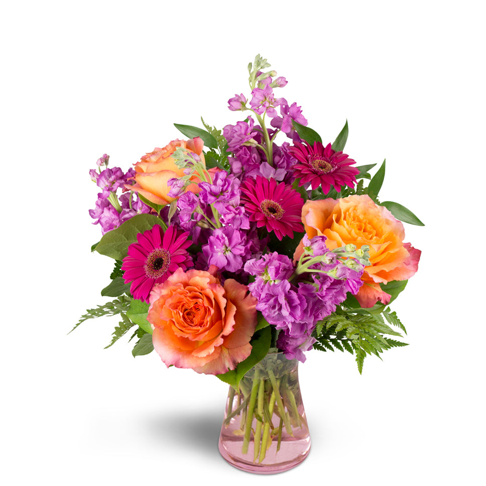 Invigorate™ - Standard. This eye-catching arrangement includes roses, mini Gerbera daisies, and more.
