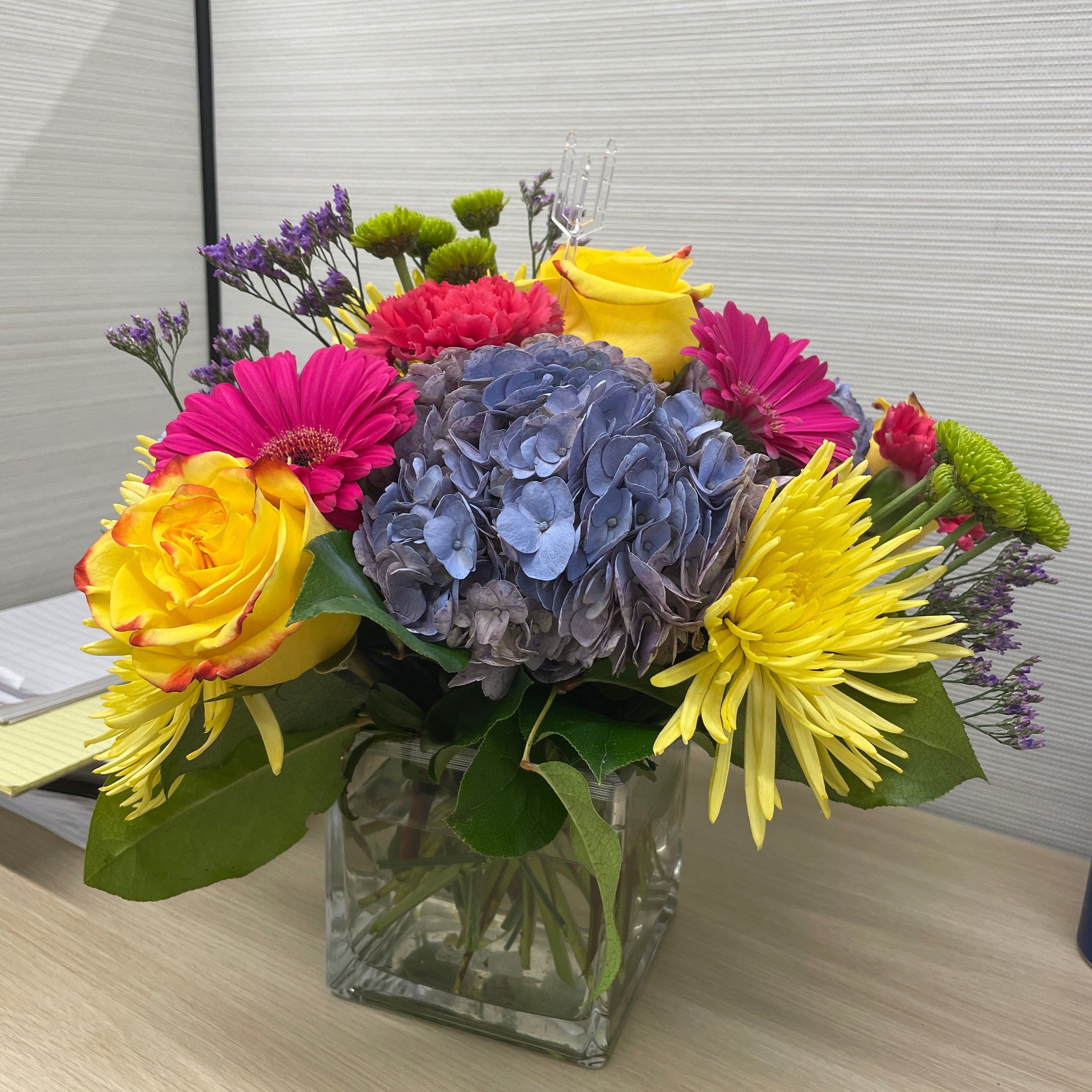 Recipient-submitted photo of Blooming Medley. Flowers placed in an office cubicle.