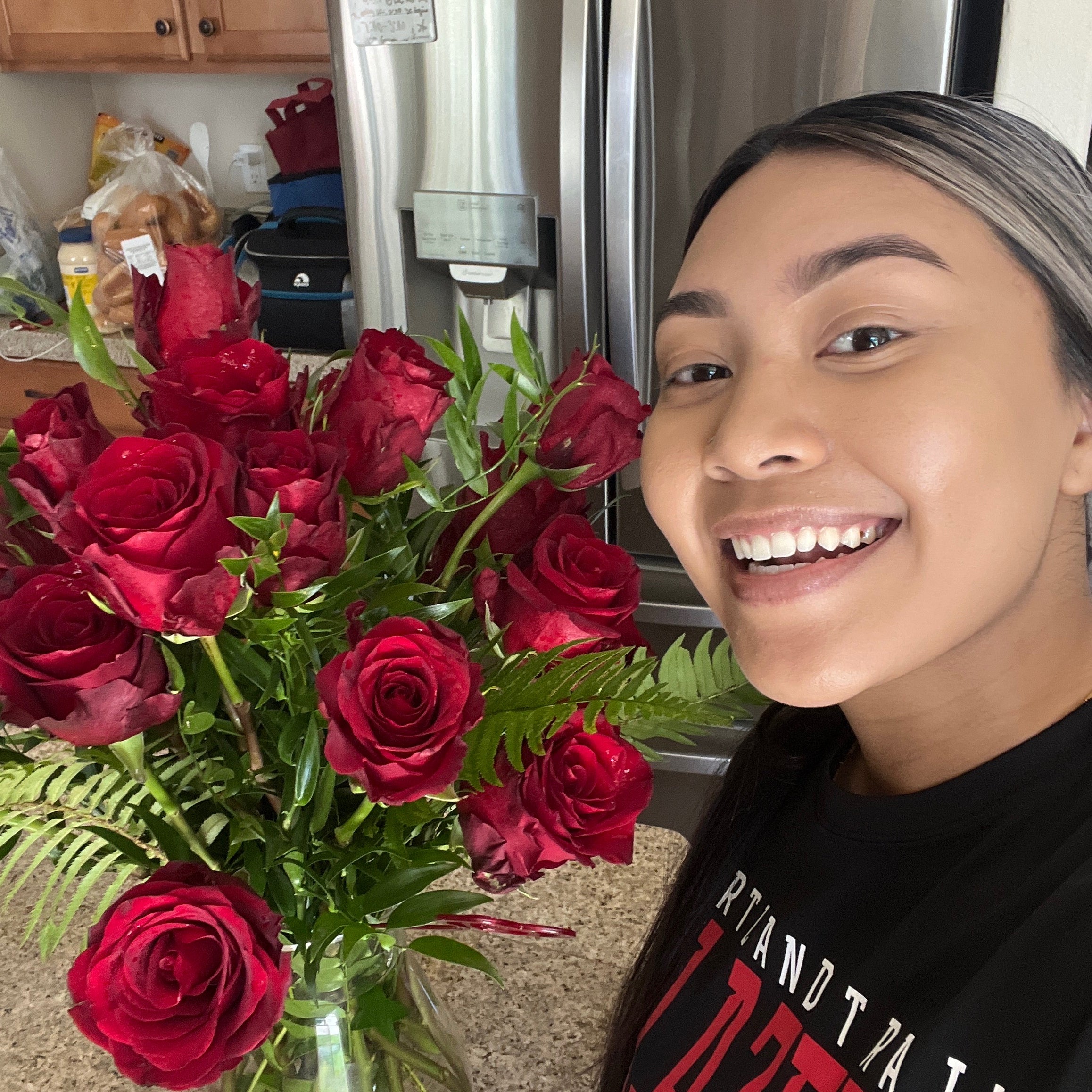 Recipient submitted photo saying thanks for Two Dozen Red Roses