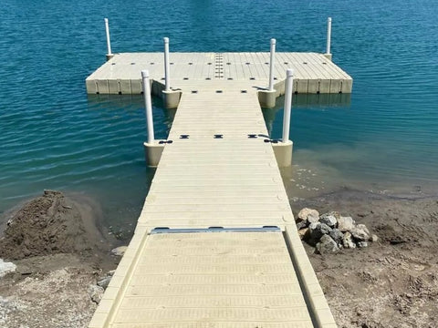 A stable floating dock system with PVC pipes and couplings, attached to the shore