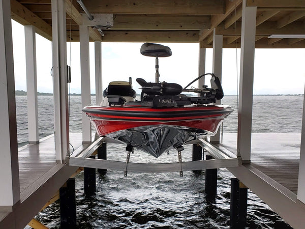 Bass Boat on an Aluminum Cradle in a Boathouse Lift