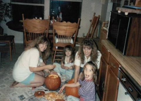 Karissa carves pumpkins on the floor of her aunt's kitchen as a child, along with her sister and mom