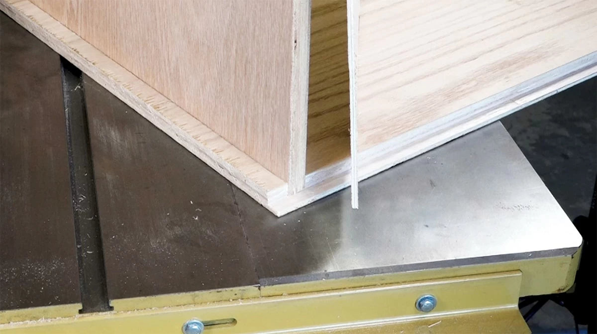 Running a rabbet at the back of the cabinet hides the back and allows for a better fit against the wall.