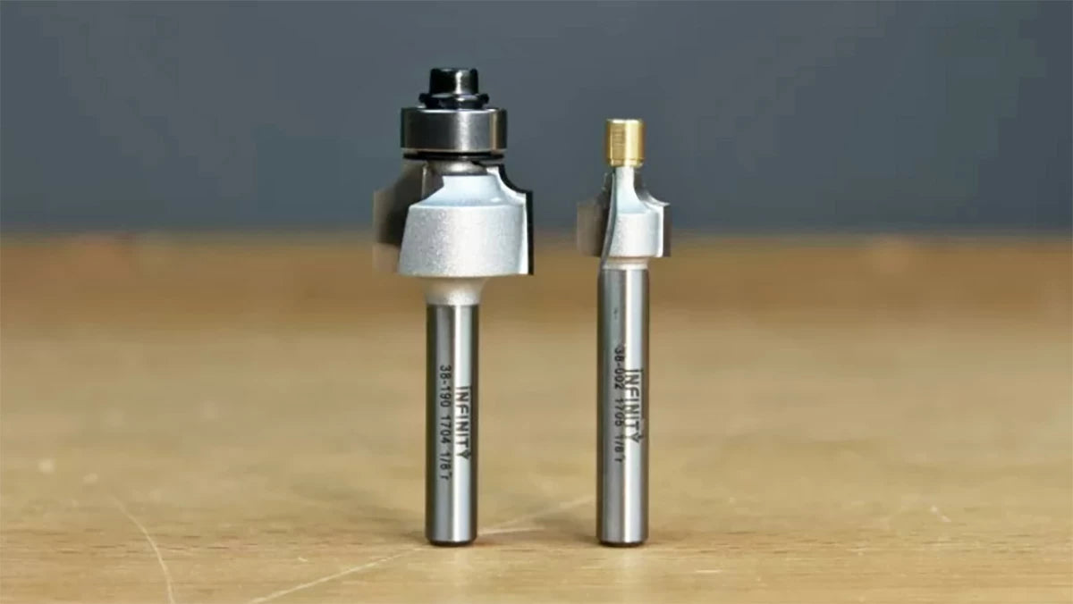 The brass pilot is able to fit into tighter areas than the traditional bearing-guided router bit on the left.