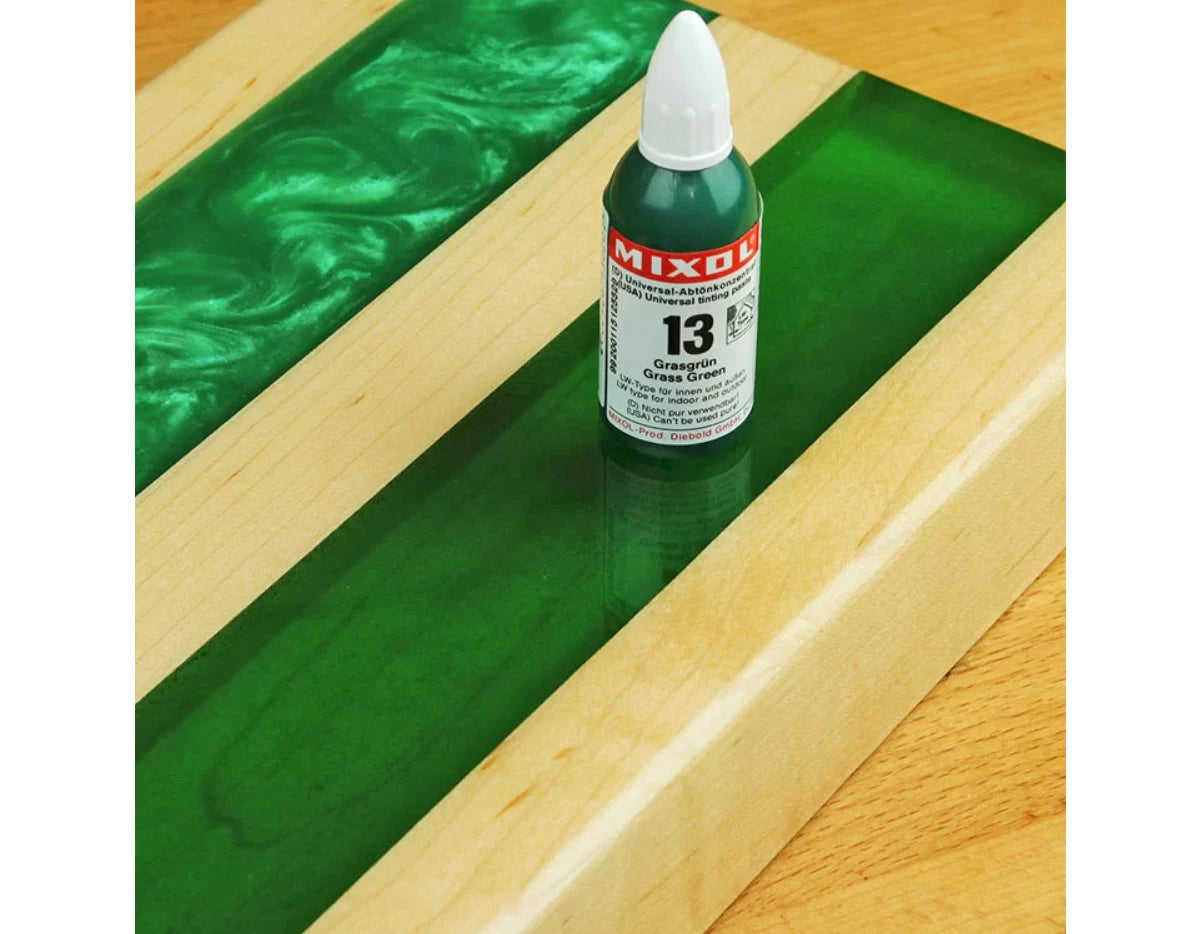 Mixol provides a flat, consistent color while leaving the epoxy transparent. This Mixol Grass Green, 117-351 sample allows the grain to show through even a 1
