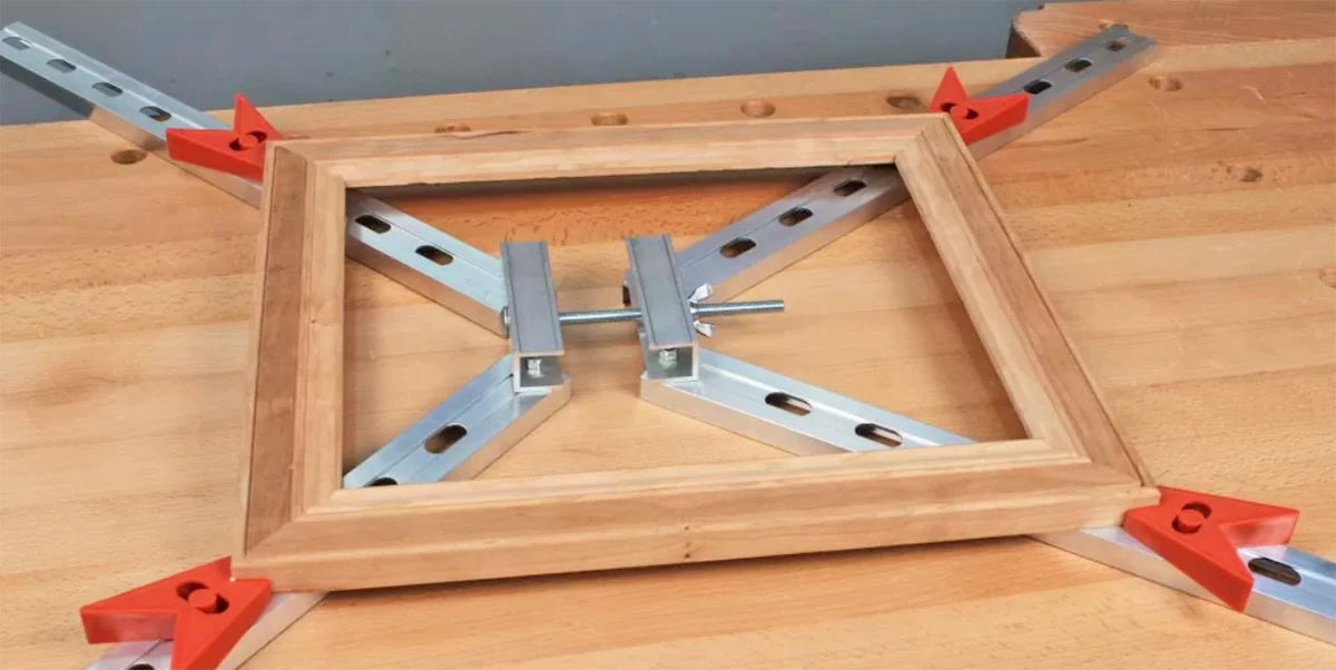 An Adjustable four corner frame clamp is the perfect choice for this type of project because it allows the corners to be pinned with a brad nailer. This allows you to remove the frame from the clamp while the glue dries.