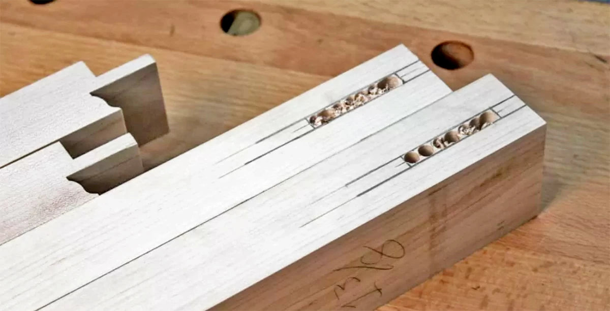 After the mortises are marked out and drilled, use chisels to remove the waste and clean up the mortises.