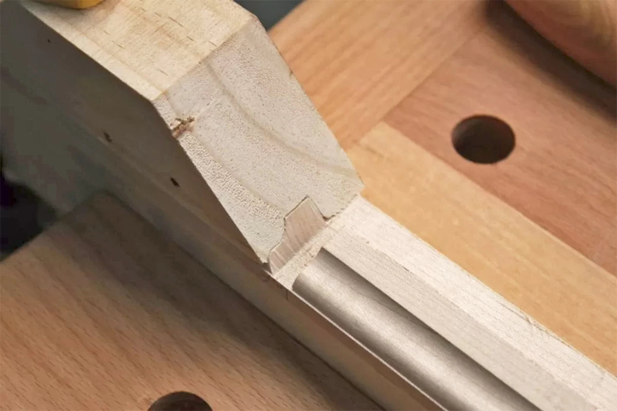 Clamping the miter block in place makes it easy to get very accurate results and guarantees a tight-fitting joint between the muntins.