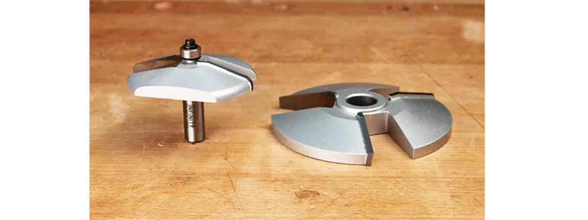 The difference between a raised panel router bit and shaper cutter of the same profile is obvious when compared side-by-side.
