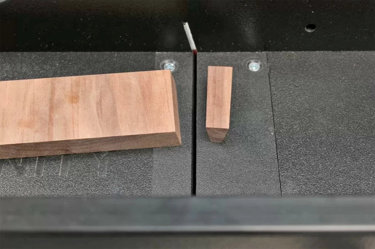 By making an initial cut then flipping the workpiece and making a second cut, the spline is perfectly tapered. The overall width of the spline can be changed by moving the adjustable stop.