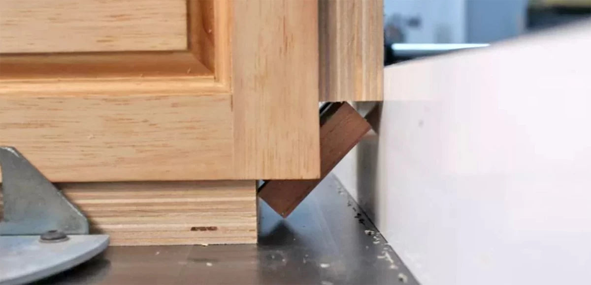 Spacer blocks make trimming the splines at the table saw an easy task.