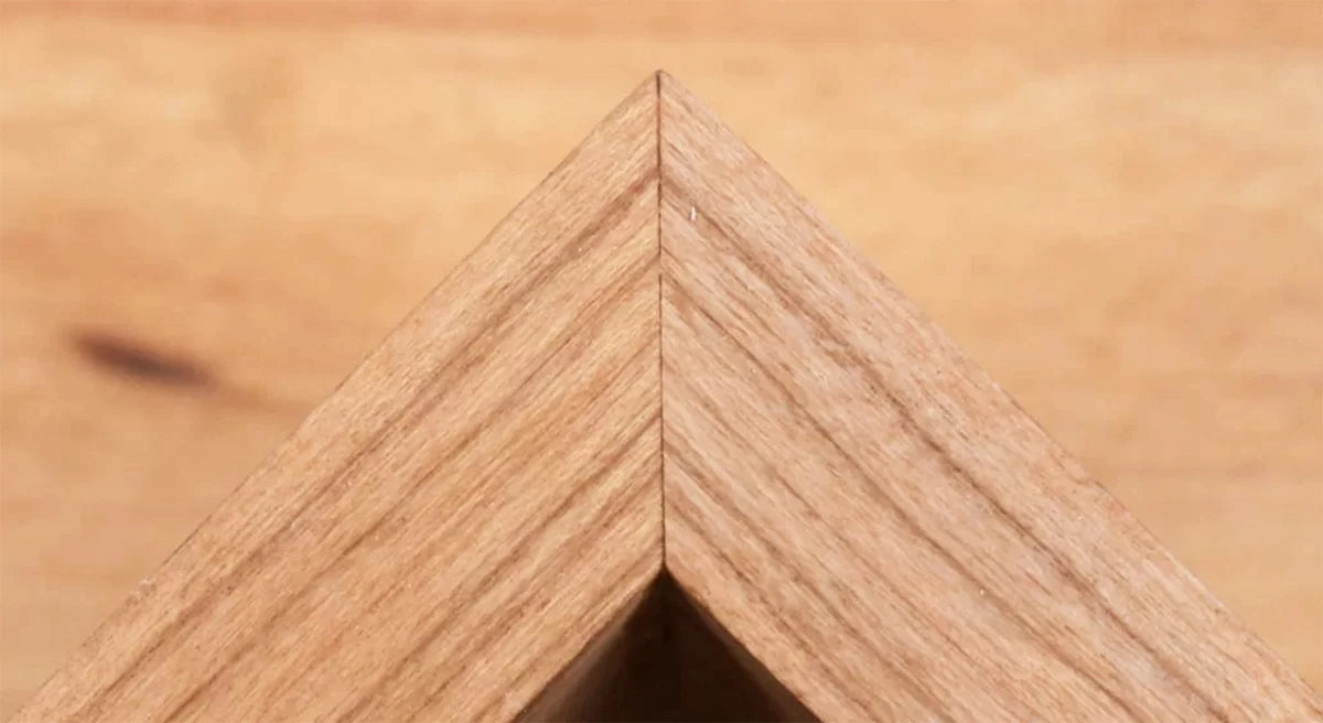 Using a 45° chamfer bit in the router table can eliminate the hassle of cutting accurate miter joints.