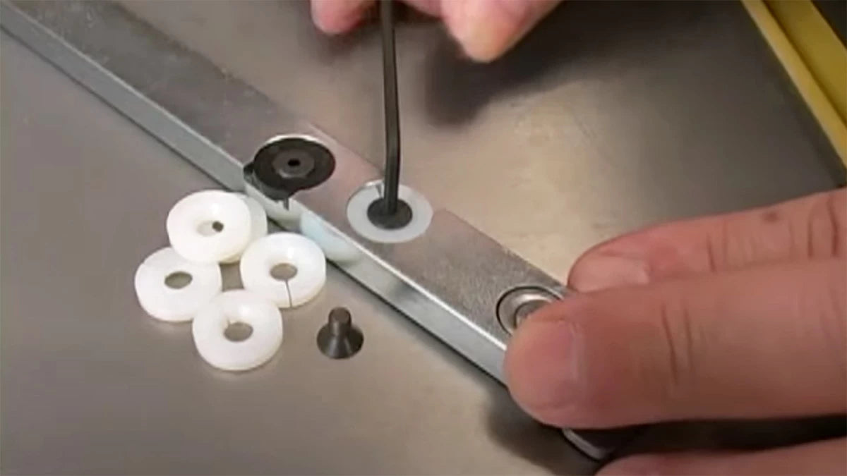 The plastic washers (multiples provided) adjust to fit to the miter slot of your saw for a perfect and smooth fit.