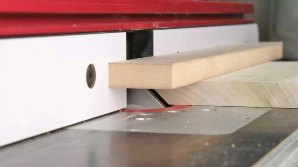 The support ensures the delicate tip of the miter is not damaged or crushed on the outfeed side of the cut.