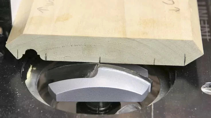 Mark the edges and center-line of each router bit to be used to make your complex crown molding and cut each profile one at a time using the center-line to set the router table fence for each. Remember to make multiple passes!