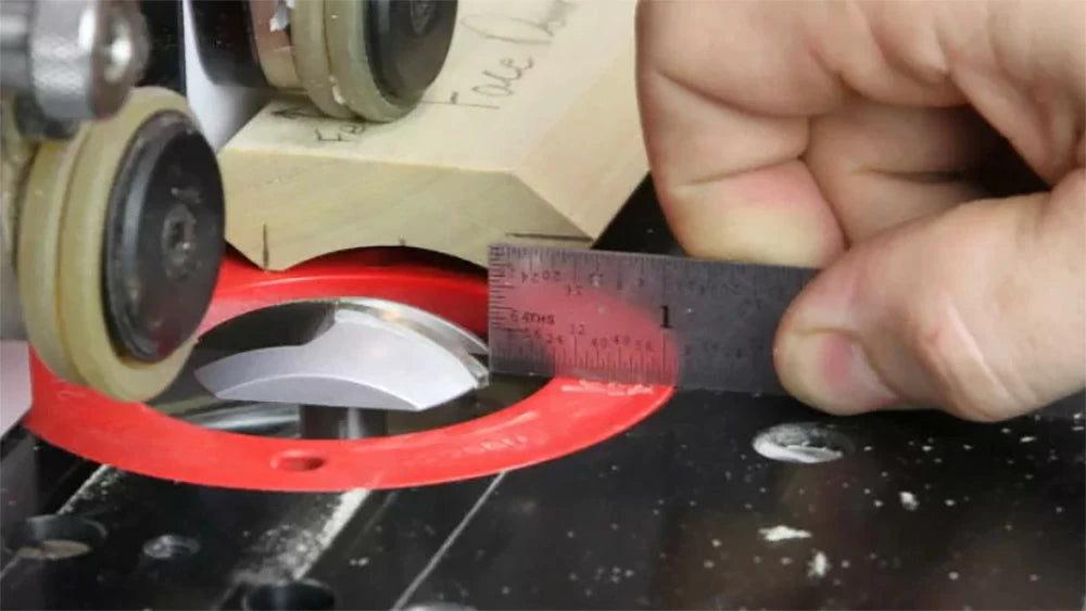 A ruler makes it easy to set the height of your profile router bit for the final pass.