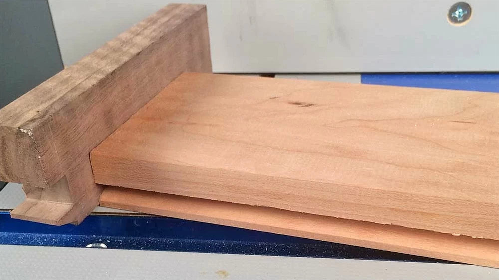 A shop-built sled will hold your thin muntins safely when routing the profile.