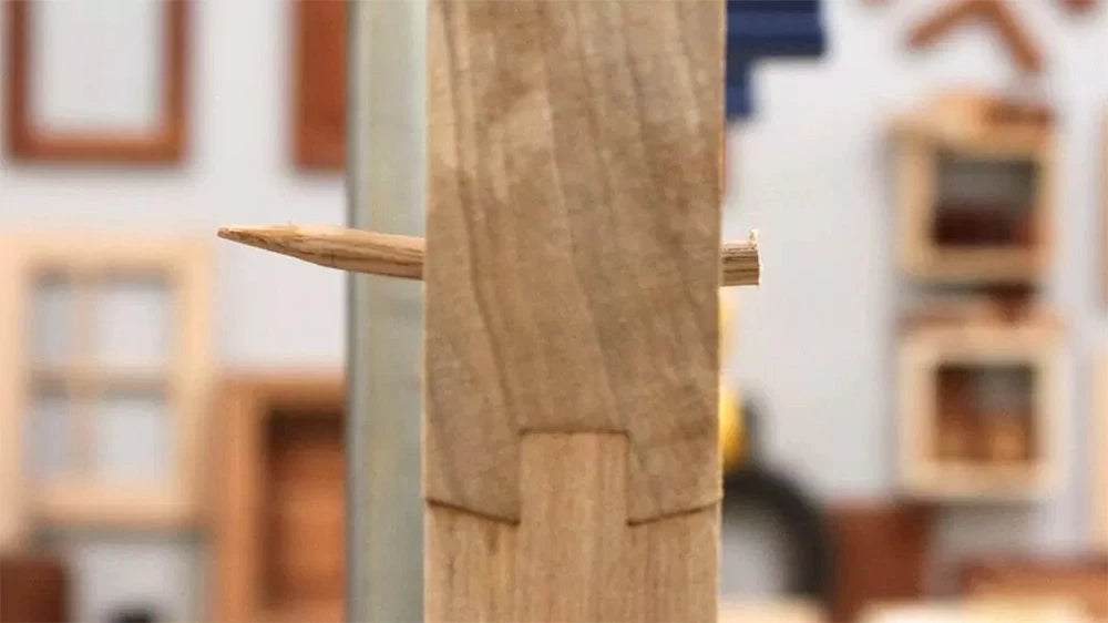 As the drawbore pin is forced through the joint, you can see how the offset holes help draw the joint tight.