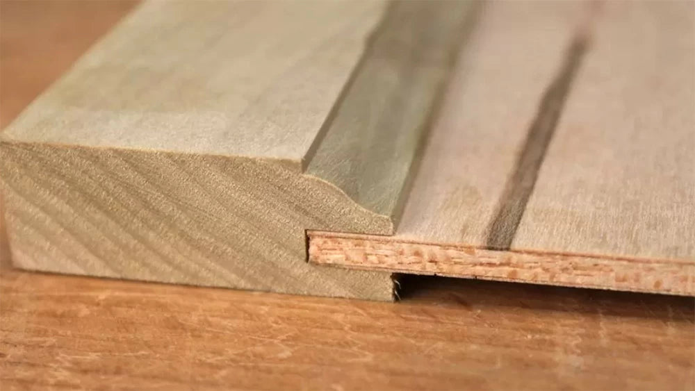 A perfect-fitting plywood panel in a door made with Infinity Cutting Tools rail and stile router bit set with plywood slot cutters.