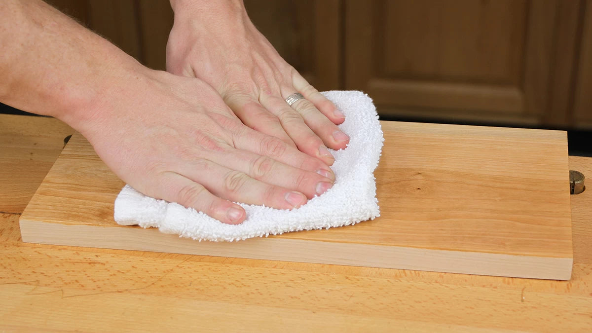 Use a cotton towel to buff the excess finish off the surface. Buff until the surface is dry and a finger pulled across the surface leaves no marks.