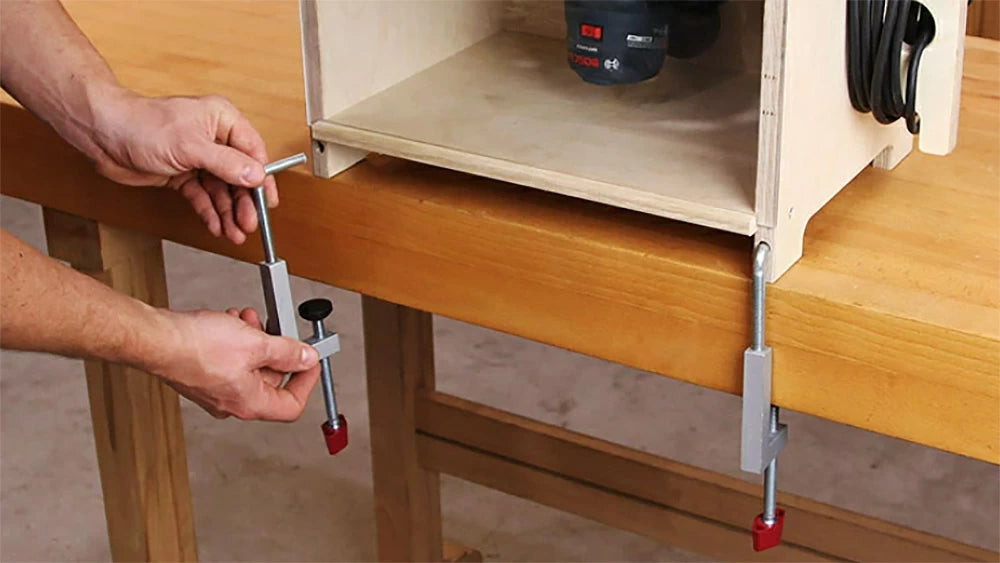 To secure the PRTS-100 to your workbench or tool stand, we recommend adding a pair of Adjustable Fence Clamps that fit snugly into a pair of holes in the front of the cabinet.