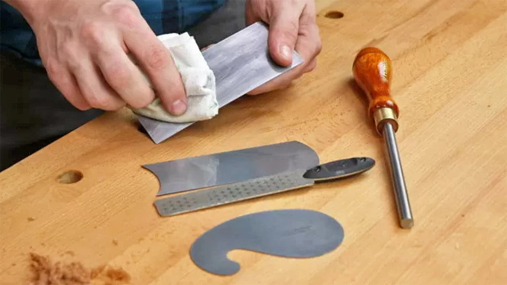 Sharpening a scraper.