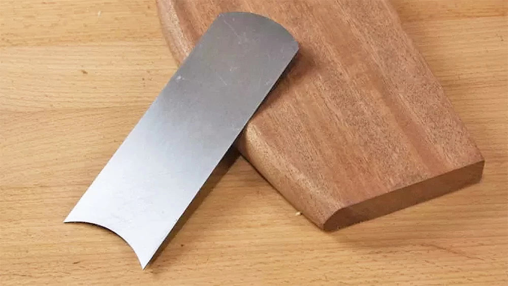 The concave/convex scraper (101-861) has two long flat edges, but each end had a radius that makes this scraper excellent at smoothing all sorts of shapes.