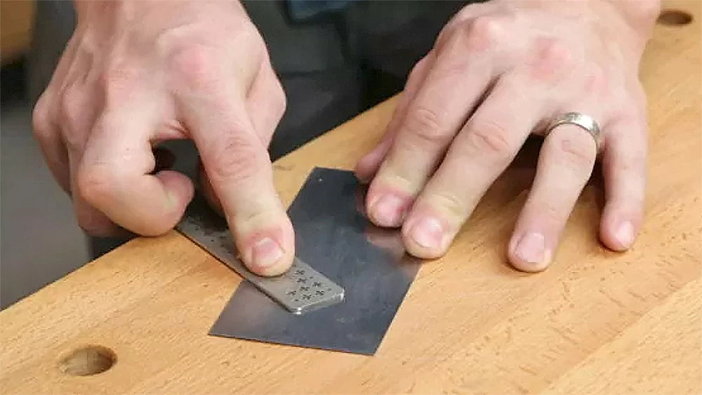 Sharpening a scraper.