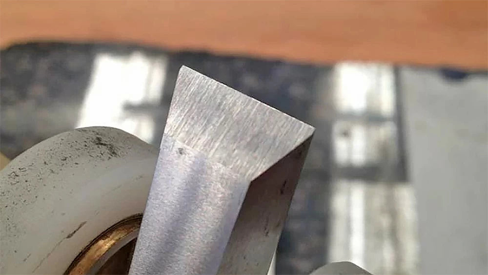 Work the bevel until the scratch pattern is across the whole face of the chisel.