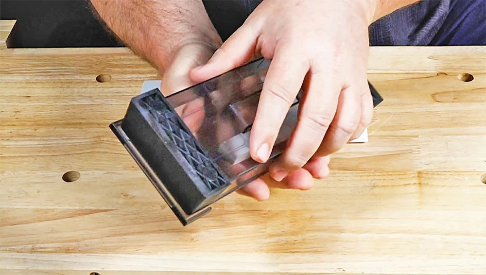 The storage box doubles as a sharpening stand, with rubber feet for stability.