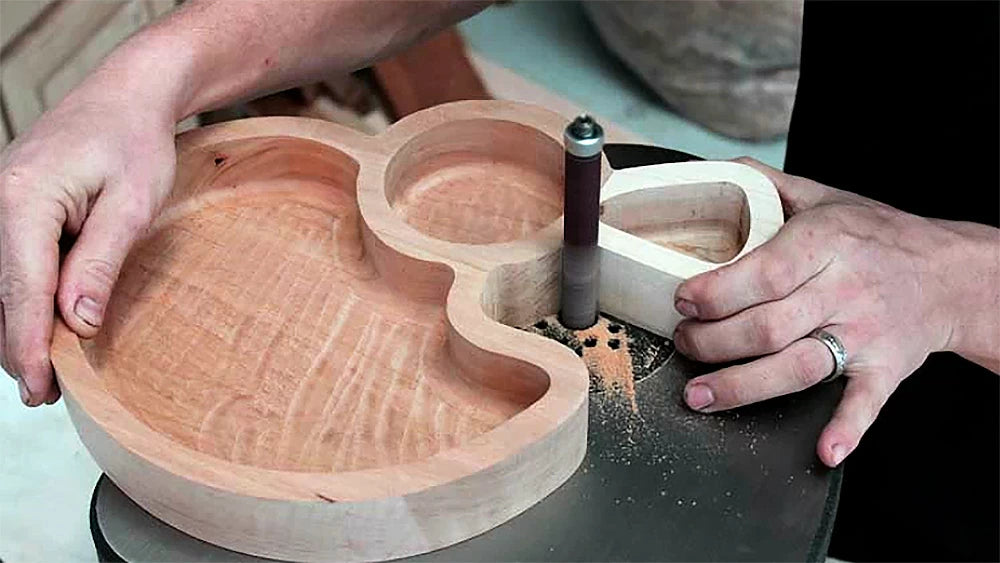 A stationary belt or disk sander does a great job of removing the saw marks on the outside curves of the tray, and a Spindle sander is ideal for getting into the tight inside corners.