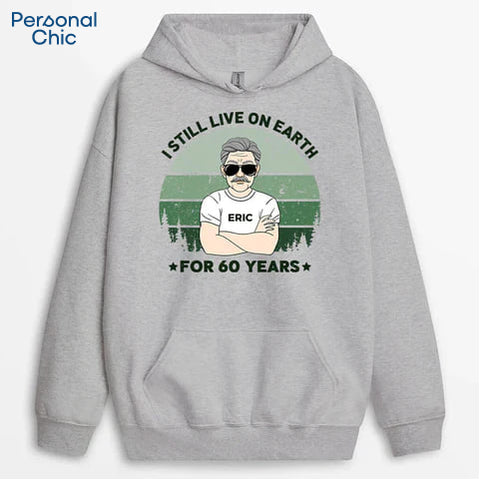 Personalised I Still Live On Earth For 60 Years Hoodie is a Perfect 60th Birthday Gift for Your Funny Father