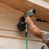 Siding Nailer putting up siding 